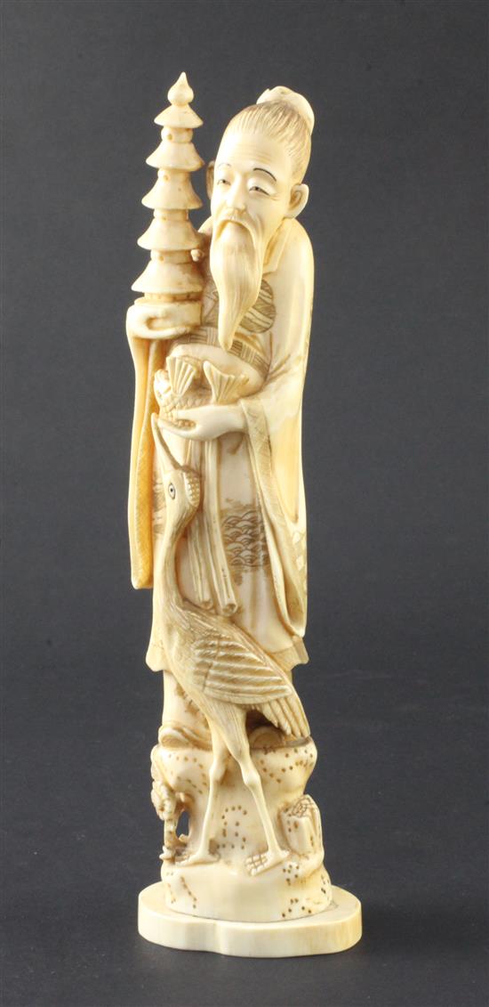 A Japanese walrus ivory figure of an immortal, early 20th century, 23.7cm